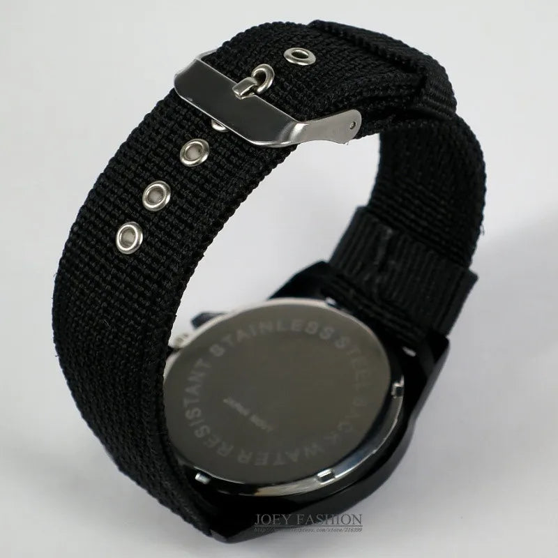 Black woven nylon watch strap with metal clasp on white background