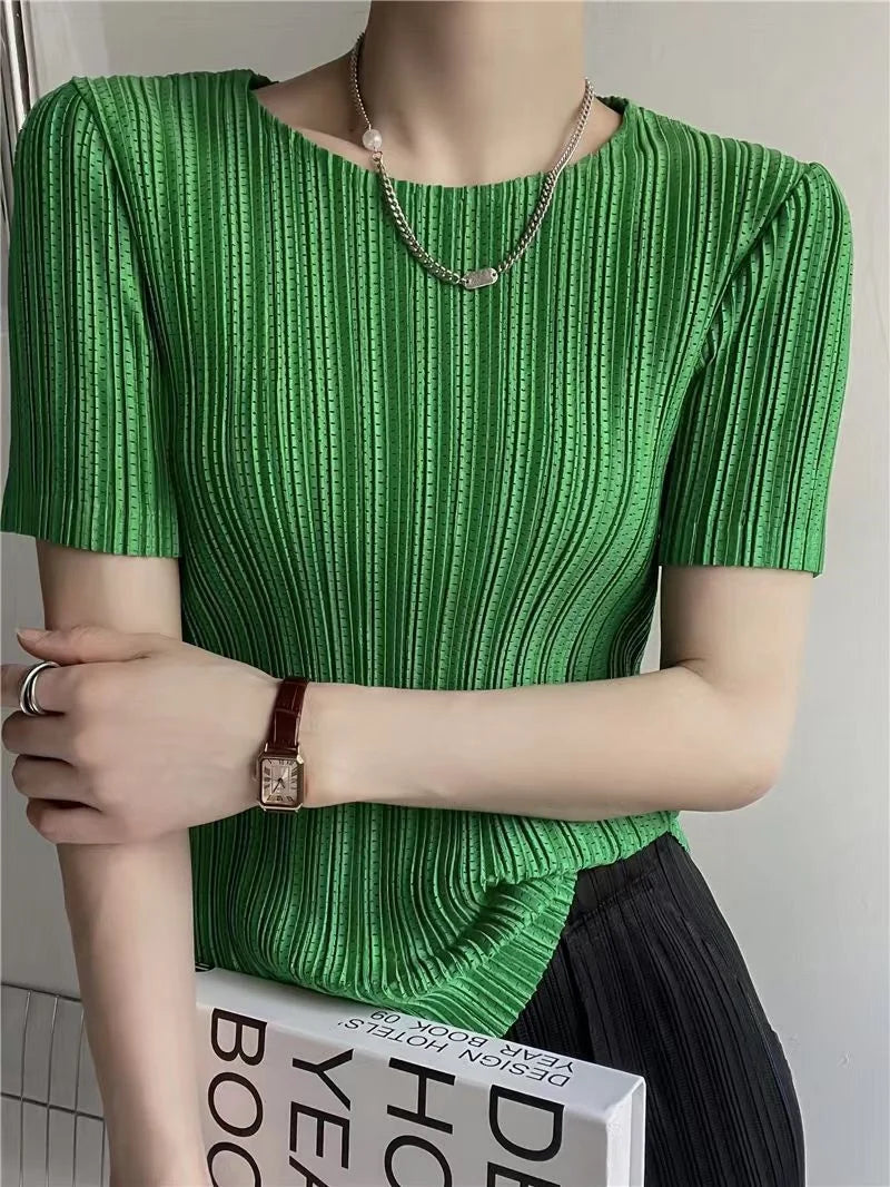 Back view of women's pleated short sleeve blouse