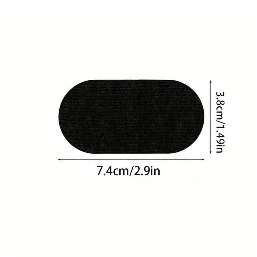 A black oval-shaped patch or applique shown on a white background with dimension labels indicating 7.4 cm by 3.8 cm.
