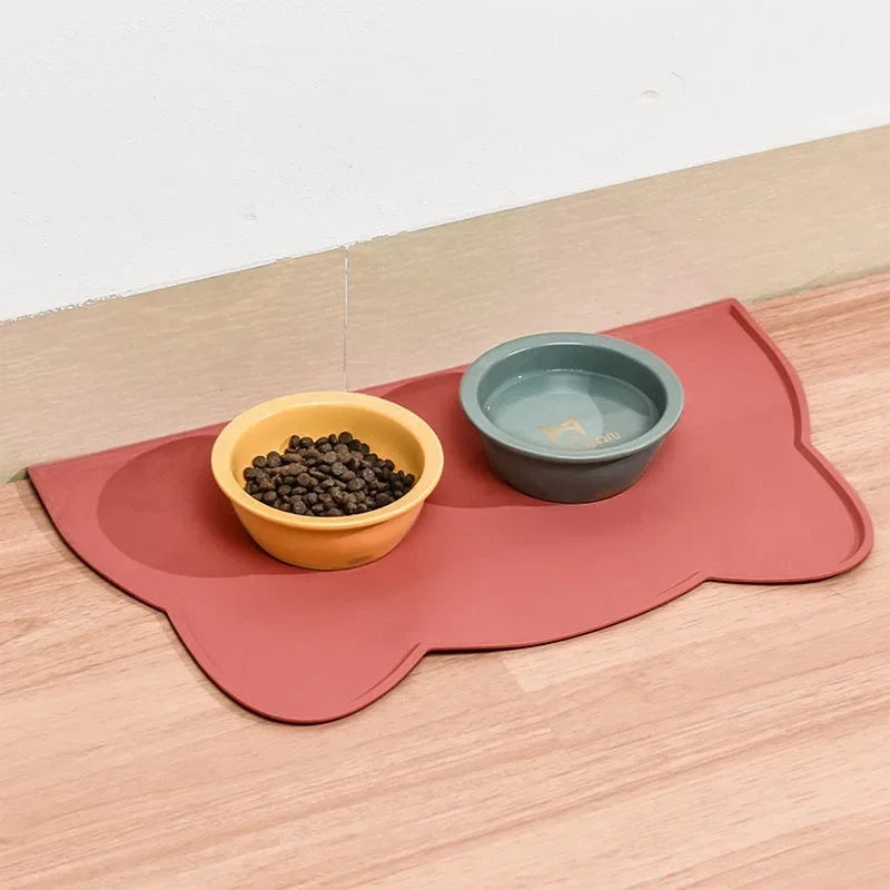 Red pet feeding mat with food and water bowls – waterproof non-slip placemat