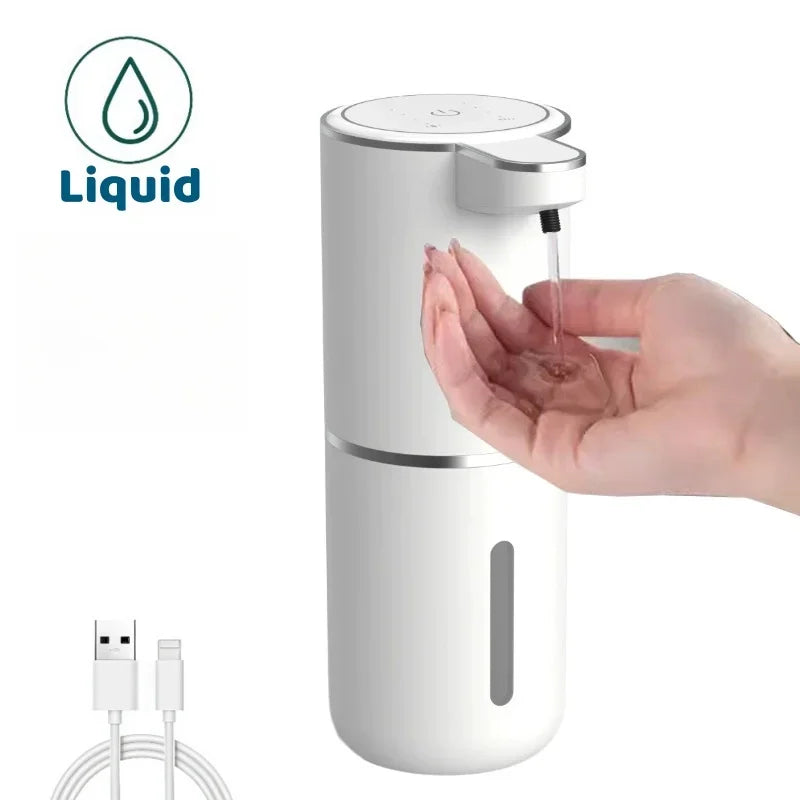 White liquid soap dispenser with hand using it, USB cable included on a white background