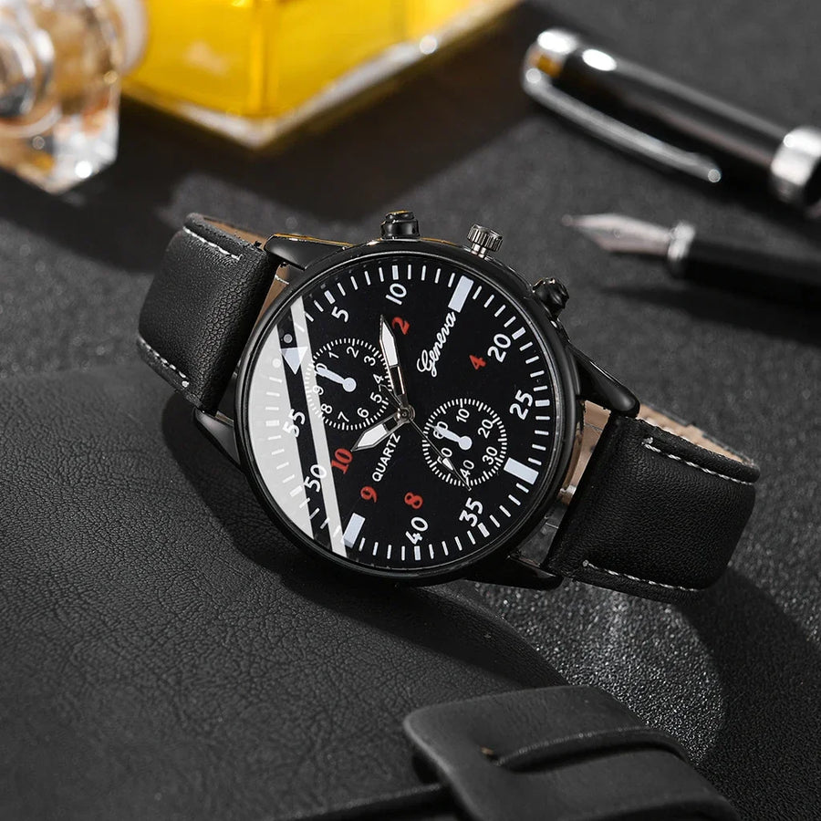 Black wristwatch with detailed face on a dark textured surface