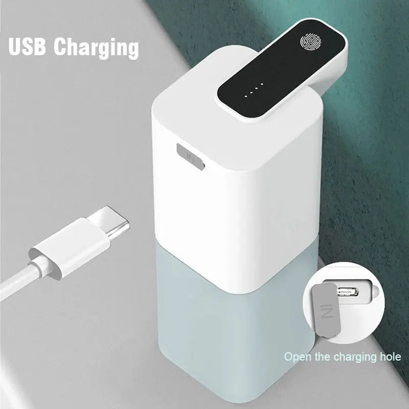 White electronic device with USB charging cable on a gray background