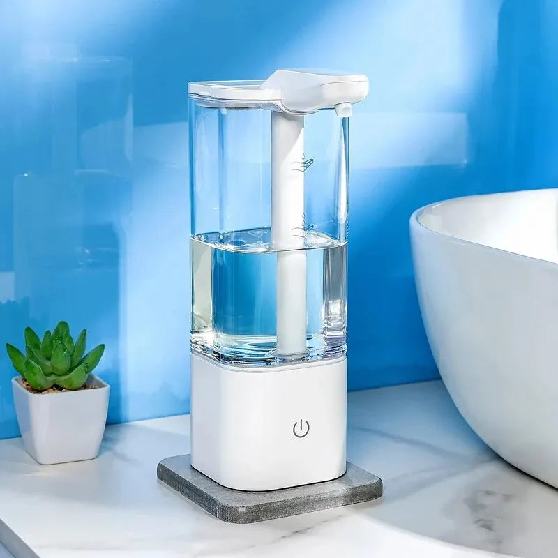 White automatic hand sanitizer dispenser with transparent tank on marble bathroom countertop with blue wall