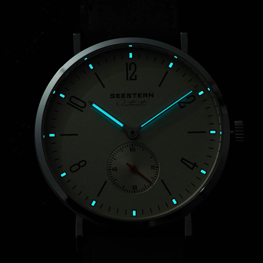 White dial brown band watch