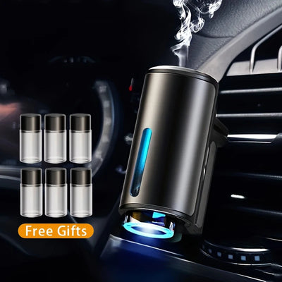 Electric car aroma diffuser humidifier – car air freshener with free gift bottles displayed in car interior