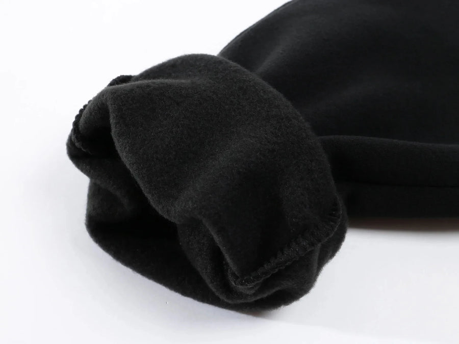 Mens fleece lined jogger sweatpants – close-up of black fabric on white background