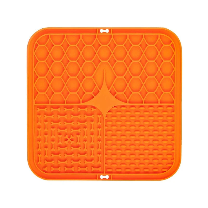 Orange silicone mat with textured surface on a white background
