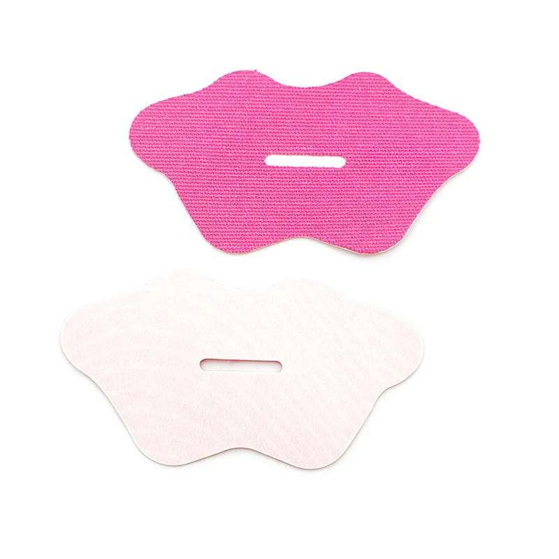 Pink anti-snoring mouth tape strip close-up on white background