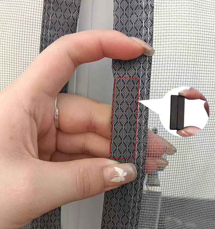Hand holding a screen repair tool over a mesh screen