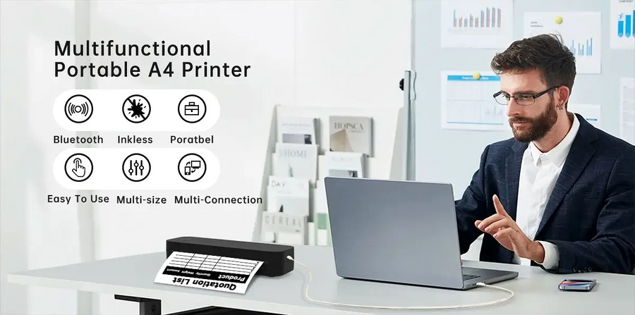 Man using a laptop with the portable A4 thermal printer on a desk — wireless Bluetooth inkless mini printer for mobile printing