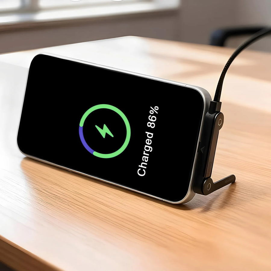 240W Type-C fast charging cable – phone with wireless charging pad on wooden surface