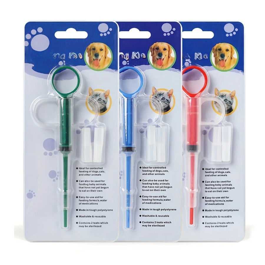 Three pet pill feeder blister packages with green, blue and red syringes and dog and cat images on cards – pet feeding kit for dogs and cats