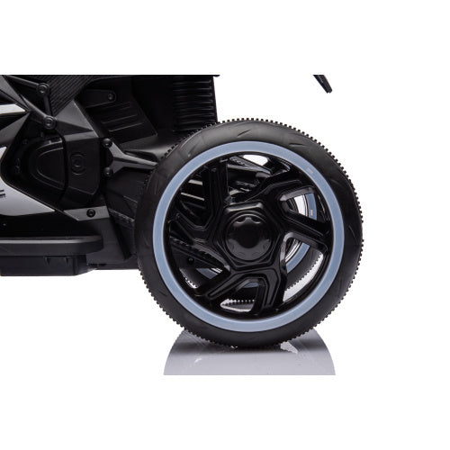 Child riding toy motorcycle