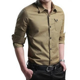 Men's khaki casual button-down shirt with rolled-up sleeves, worn by a model