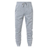 Men's gray casual jogger sweatpants with drawstring waist and cuffed ankles on white background