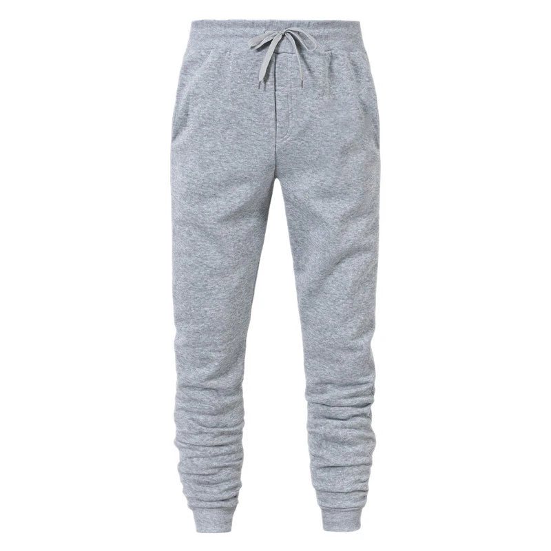 Men's gray casual jogger sweatpants with drawstring waist and cuffed ankles on white background