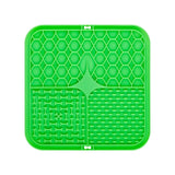 Green silicone mat with textured design on a white background