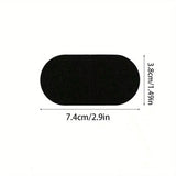 A black oval-shaped patch or applique shown on a white background with dimension labels indicating 7.4 cm by 3.8 cm.