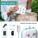 Person holding mini Bluetooth thermal label printer with cartoon face, bag and charging cable
