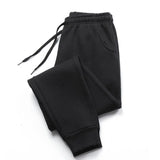 Men's black jogger sweatpants with cuffed ankles on white background