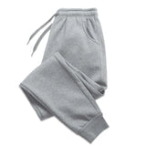 Men's gray jogger sweatpants detail view on white background
