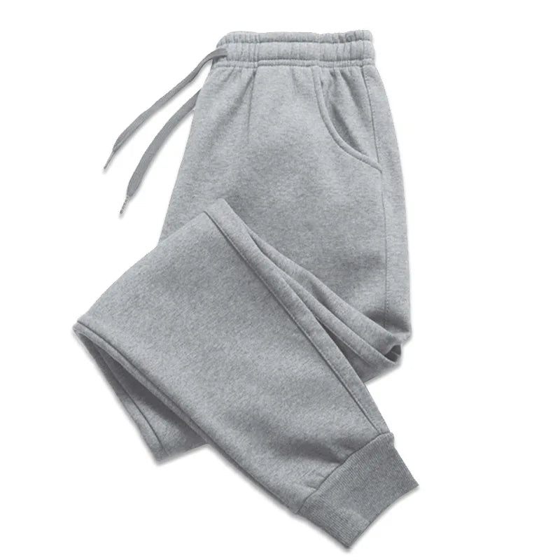 Men's gray jogger sweatpants detail view on white background