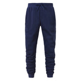 Navy blue jogger pants on a white background