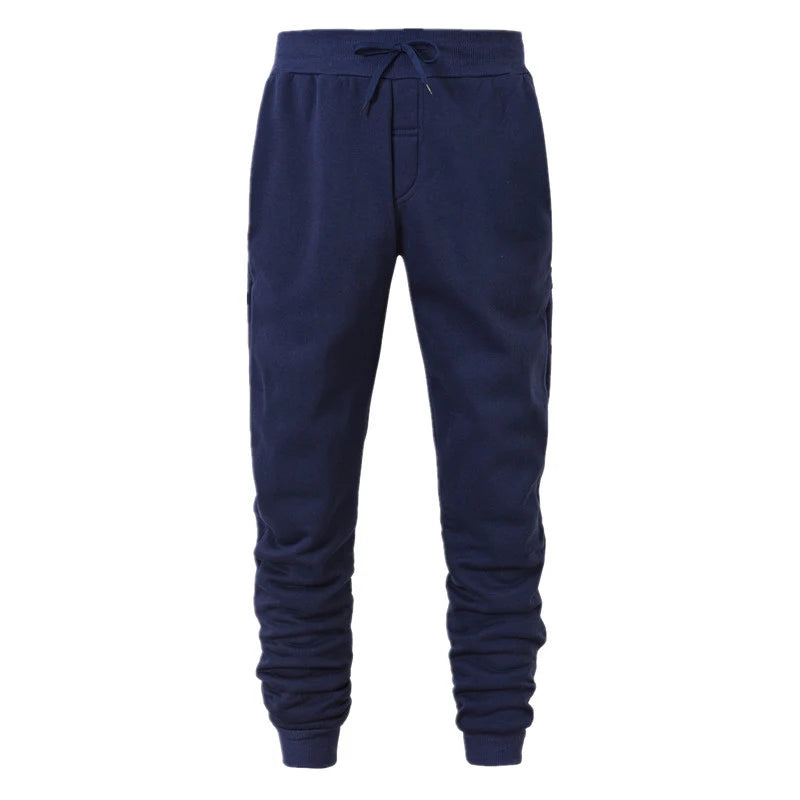 Navy blue jogger pants on a white background