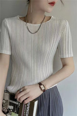 Close-up of pleated texture on women's short sleeve blouse