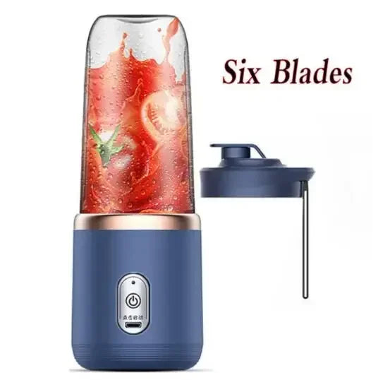 Navy portable USB rechargeable personal blender with six blades blending a red smoothie, travel lid beside it
