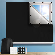 Blackout window tint film installed on a window, showcasing sun-blocking and privacy features.