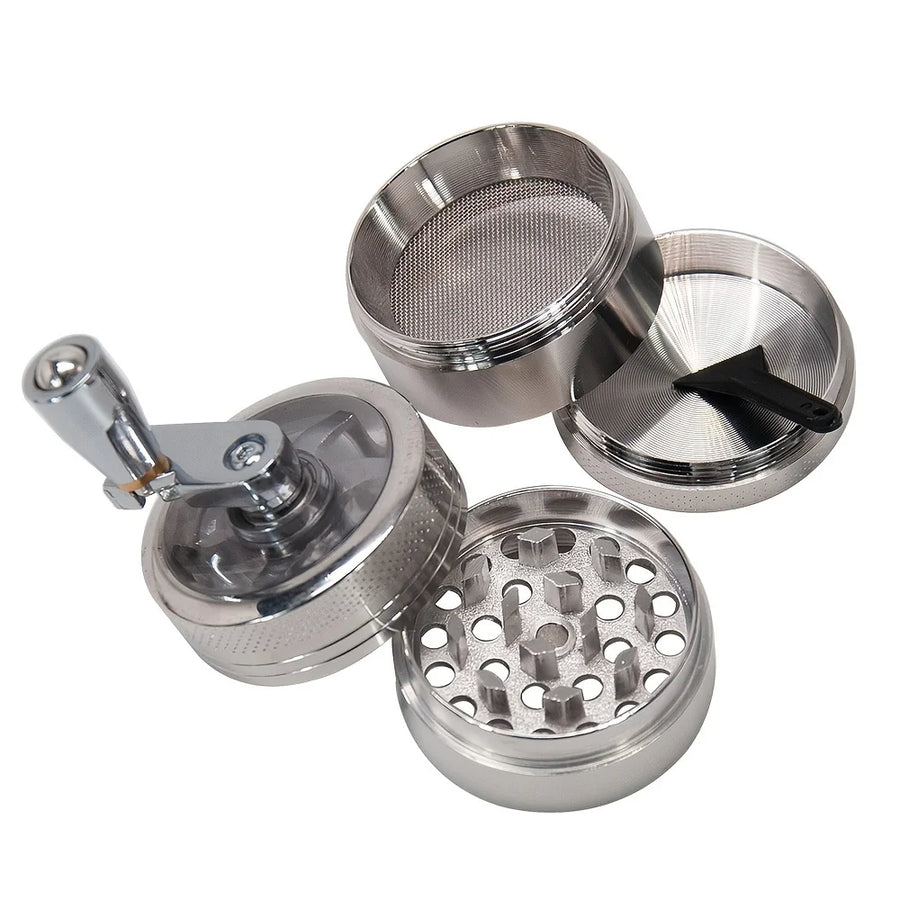 Metal grinder with multiple compartments on a white background