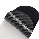 Close-up of black anti-snoring mouth tape strip showing breathable fabric texture