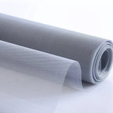 Roll of gray mesh fabric on a white background