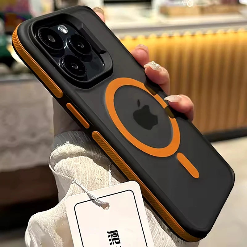 Phone case with orange accents held by a person, with a blurred background