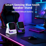 Smart sensing Bluetooth speaker stand with 5000mAh lithium battery on a gaming desk.