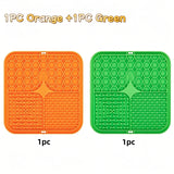 Two silicone mats, one orange and one green, on a white background with text indicating quantity.