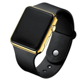 Black LED digital sport watch with gold frame and black silicone band on white background, gold unisex casual watch.