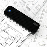 Black portable thermal printer with blue logo on architectural blueprints — wireless Bluetooth inkless A4 mini printer