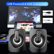 USB wired computer speakers with LED light beside a smartphone, showcasing vibrant LED lighting and modern design.