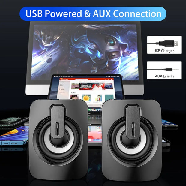USB wired computer speakers with LED light beside a smartphone, showcasing vibrant LED lighting and modern design.