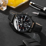 Black wristwatch with detailed face on a dark textured surface