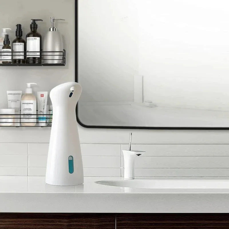 White electronic device on a kitchen counter with a blurred background
