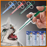 Pet pill feeder syringes in blue, red and green with finger-ring plungers – hand administering medicine to a cat, with retail packaging