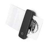 Black portable Bluetooth thermal label printer printing a black and white eagle illustration — wireless inkless label maker
