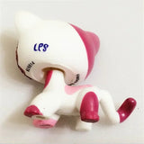 Mini pet shop kitty figure – white with pink patches, rear view showing printed lettering on its back