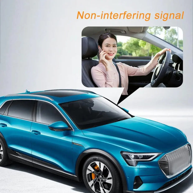 Blue electric SUV with driver using phone, showcasing non-interfering signal technology for enhanced connectivity.