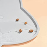 Waterproof pet feeding mat close-up – non-slip textured gray surface