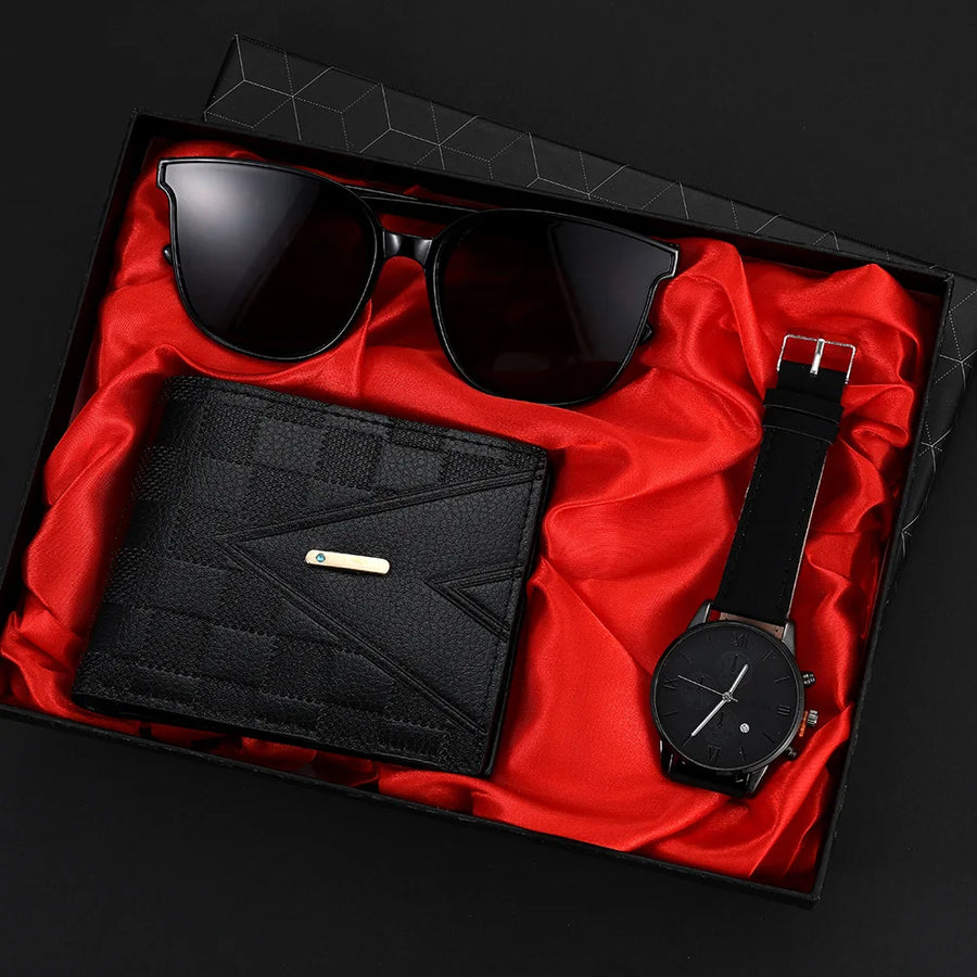 Set of black sunglasses, wallet, and watch in a box with red lining